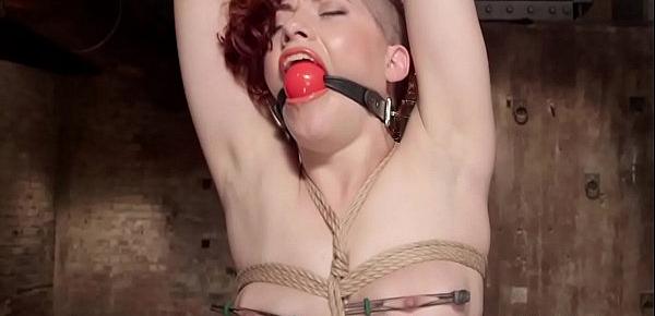  Gagged redhead set on wooden horse